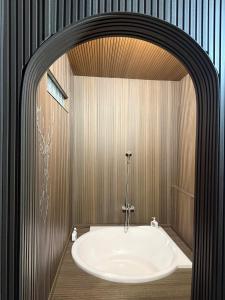 a bathroom with a bath tub in a room at Nha Cua Bot Homestay 5BR 4BA in DaLat in Da Lat +19 photos