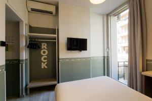 Postel nebo postele na pokoji v ubytování Hotel Nologo