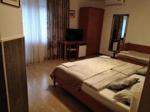 Postel nebo postele na pokoji v ubytování Rooms Kapelj
