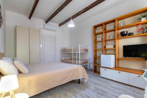TV a/nebo společenská místnost v ubytování Alguer Guest House