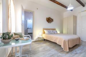 Postel nebo postele na pokoji v ubytování Alguer Guest House
