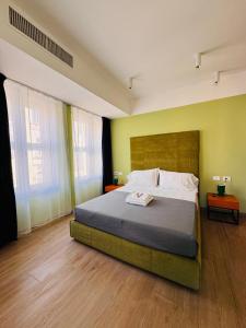 Giường trong phòng chung tại Hotel Vitruvio
