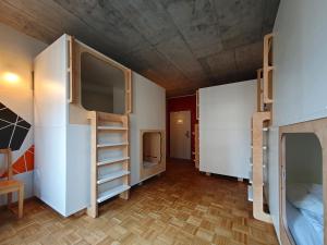 Ένα ή περισσότερα κρεβάτια σε δωμάτιο στο Five Elements Hostel and Capsules Frankfurt