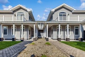 a large white house with white columns at Loggerhead - Leatherback #903 in Bethany Beach