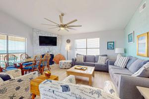 a living room with a couch and a table at The Beach House in Gulf Shores
