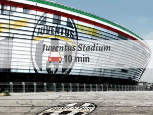 a building with a car painted on the side of it at Miramonti Simple Stay in Turin