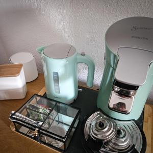 a green and white blender sitting on a table at Cortijo El Ancla in Albox