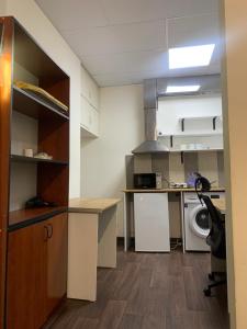 a small kitchen with a sink and a stove at Family Hostel and Tours in Yerevan +5 photos