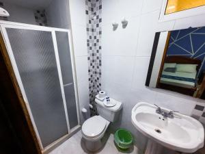 a bathroom with a sink and a toilet and a shower at Hotel Marie Real Cartagena in Cartagena de Indias +51 photos