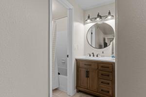 a bathroom with a sink and a mirror at Idaho Treasure Hunt in Boise +30 photos