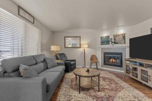 a living room with a couch and a fireplace at Idaho Treasure Hunt in Boise