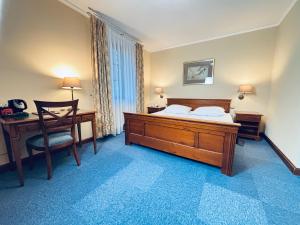 Postel nebo postele na pokoji v ubytování Hotel Opera