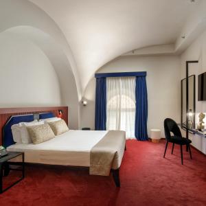 Postel nebo postele na pokoji v ubytování Hotel Monte Cenci