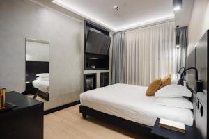 Postel nebo postele na pokoji v ubytování Dream Suite Trevi
