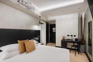 Postel nebo postele na pokoji v ubytování Dream Suite Trevi