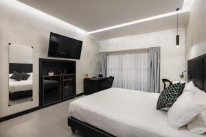 Postel nebo postele na pokoji v ubytování Dream Suite Trevi