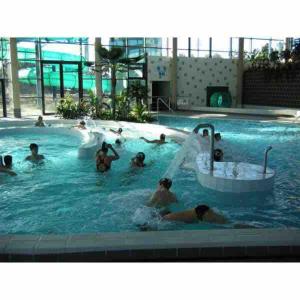 a group of people in a swimming pool at Maison Jardin Proche Paris in Sainte-Geneviève-des-Bois