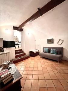 A bed or beds in a room at Stecadó Casté - Dimora storica nel cuore del paese