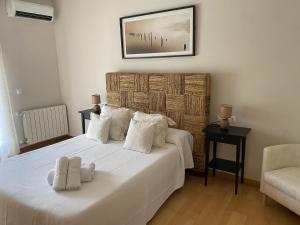 Ένα ή περισσότερα κρεβάτια σε δωμάτιο στο Casa Las Terrazas del Lago Alojamiento Rural +39 φωτογραφίες