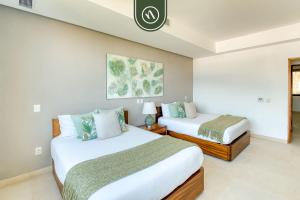 Ένα ή περισσότερα κρεβάτια σε δωμάτιο στο Luxury 4 BR Condo - Amazing Bay View - Pool