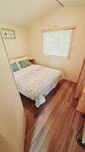 a bedroom with a bed and a window at 6 Guests - 3 Bedrooms - Entertainment - Near Beach in Sheerness +27 photos