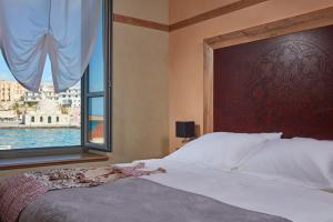 Postel nebo postele na pokoji v ubytování Domus Renier Boutique Hotel
