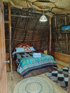 Postel nebo postele na pokoji v ubytování Wasi Andina Lodge