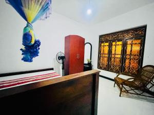 a room with a desk and a chair and a window at Yala Elephant Pass in Buttala
