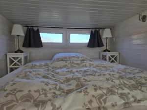 Postel nebo postele na pokoji v ubytování Tiny House