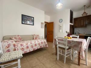 a living room with a couch and a table at Lipari Centro Storico Flat 7 mins from port in Lipari