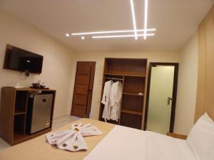 A bed or beds in a room at Inside Pyramids Hotel
