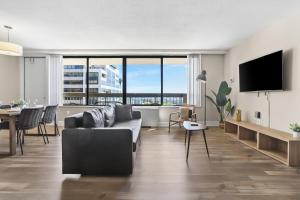 a living room with a couch and a table at Stylish Apt in Crystal City in Arlington