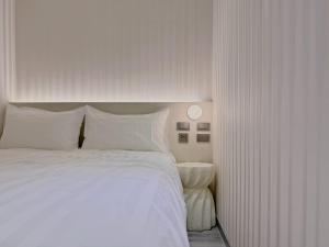 Letto o letti in una camera di 在家行旅 南西館