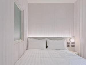 Letto o letti in una camera di 在家行旅 南西館
