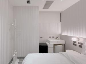 Letto o letti in una camera di 在家行旅 南西館