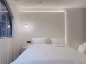 Letto o letti in una camera di 在家行旅 南西館