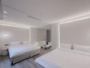 Letto o letti in una camera di 在家行旅 南西館