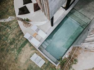 an overhead view of a swimming pool in a house at Media Luna BoHo Chic Villa E11 Pvt Pool Concierge in Tulum