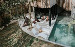 an overhead view of a hammock and a swimming pool at Media Luna BoHo Chic Villa E11 Pvt Pool Concierge in Tulum