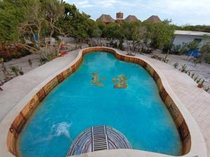 an overhead view of a swimming pool at a resort at Experiencia Casa Blanca in Dzilam de Bravo