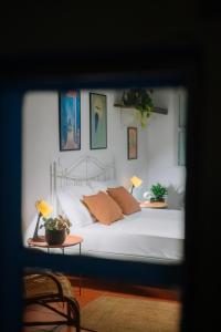 a bedroom with a bed and a table with two lamps at Mayelia Ηouse in the old town in Rhodes Town