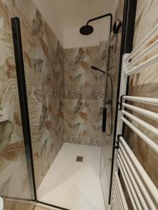 a shower with a glass door in a bathroom at La sosta 2-Casa accanto alla stazione dei treni in Modena