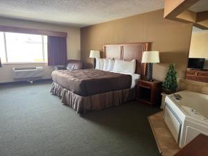 Postel nebo postele na pokoji v ubytování FairBridge Inn & Suites McAlester