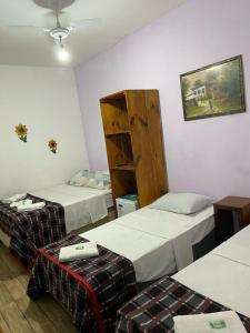 Postel nebo postele na pokoji v ubytování Pousada Chiclé Penedo MC
