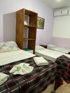 Postel nebo postele na pokoji v ubytování Pousada Chiclé Penedo MC