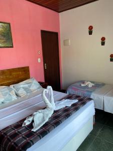 Postel nebo postele na pokoji v ubytování Pousada Chiclé Penedo MC