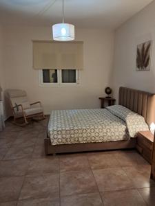 Posteľ alebo postele v izbe v ubytovaní ILIANA.APARTMENTS
