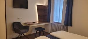 Televízia a/alebo spoločenská miestnosť v ubytovaní Gasthof Schauer