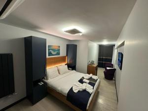 Postel nebo postele na pokoji v ubytování VAMA TAKSİM Hotel