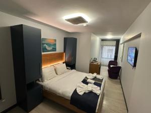 Postel nebo postele na pokoji v ubytování VAMA TAKSİM Hotel